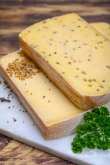 Belgian cheeses from abbey made from cow milk with monks beer, fenugreek and mustard seeds