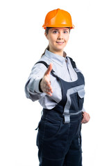 Young beautiful woman engineer in protection uniform doing handshake gesture. Isolated