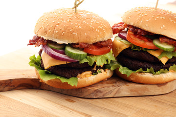 Tasty fresh meat burgers with salad and cheese. Homemade angus burger.