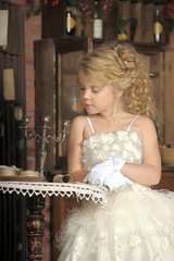 Princess in a white dress. Flowergirl, event.