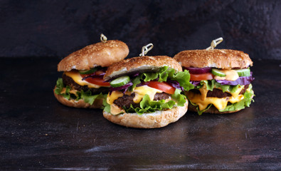 Tasty fresh meat burgers with salad and cheese. Homemade angus burger.