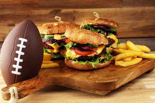 Tasty fresh meat burgers with salad and cheese. Homemade angus burger. Great for Bowl football Game angus burger
