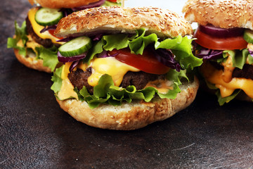 Tasty fresh meat burgers with salad and cheese. Homemade angus burger.