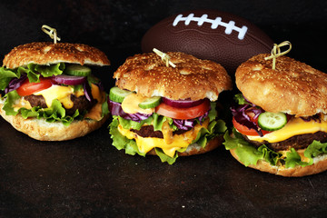 Tasty fresh meat burgers with salad and cheese. Homemade angus burger. Great for Bowl football Game angus burger