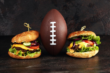 Tasty fresh meat burgers with salad and cheese. Homemade angus burger. Great for Bowl football Game...