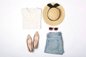 set of fashionable women's clothing and accessories on a white background top view. 