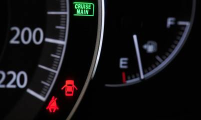 Warning signs on modern car dashboard