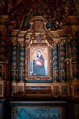 Fototapeta premium Painting of the Madonna and child with gold ornaments