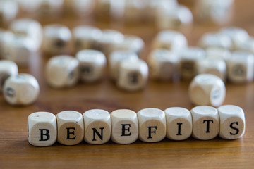 Benefits Written with wooden cubes