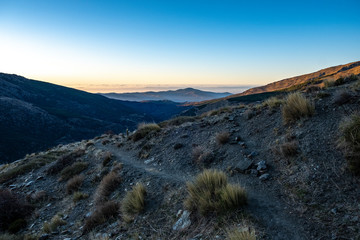 Sunrise over mountain path