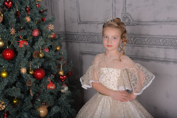 blonde princess in white elegant christmas dress