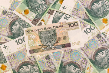 Polish banknotes. One hundred Zloty pile background. Cash money in Poland