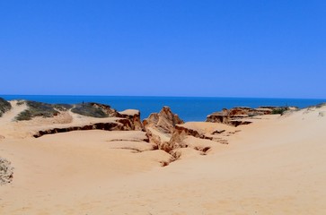 Fototapeta na wymiar Cliffs in Beberibe, Ceara, Brazil, sands of Morro Branco beach.