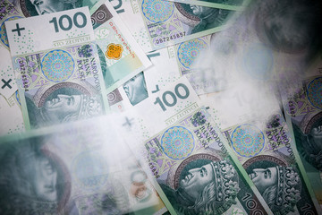 Polish banknotes. One hundred Zloty pile background. Cash money in Poland
