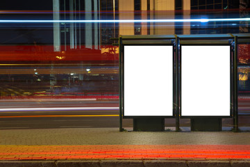 Blank binary billboard in night traffic
