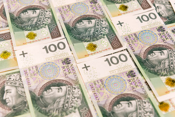 Fototapeta na wymiar Polish banknotes. One hundred Zloty pile background. Cash money in Poland