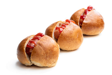 Set of three mini hotdogs isolated on white background
