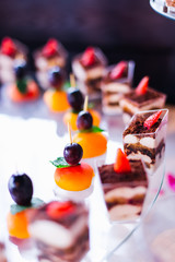 top view of cupcakes and fruits. apricot with grapes are connect