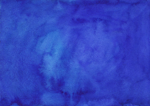 Watercolor deep lapis blue background texture hand painted.  Watercolour blue violet stains on paper.