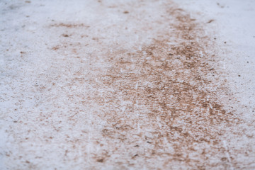 Sand on snow. Abstract defocused background with dirty white snow.