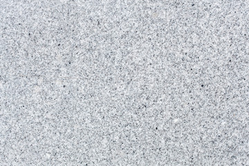 seamless mottled gray and beige granite texture with dark blue splashes. stone surface