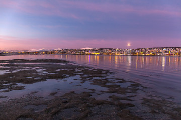 Amazing sunrise with amazing magenta color over Tromso, Norway. Polar night. long shutter speed
