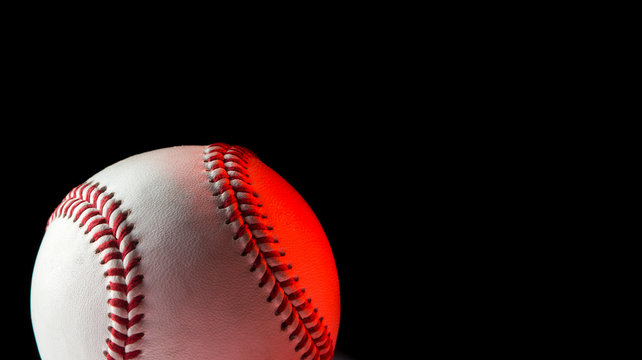 Baseball ball isolated on black background. Blue neon Banner Art concept