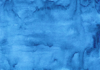 Watercolor watery blue background texture. Hand painted watercolour backdrop. Sky blue stains on paper.