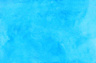 Watercolor light cyan background painting. Watercolour bright sky blue stains on paper. Artistic backdrop.