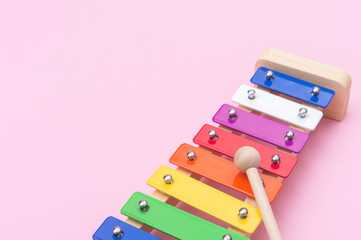 Colour xylophone isolated on pink background