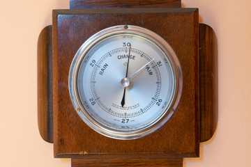 Close up of an antique barometer indicating high pressure
