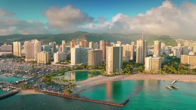 Aerial view of the magnificent tropical beaches and luxury hotels throughout the shoreline in Oahu island and the Kahanamoku Beach. Hawaii. U.S.
