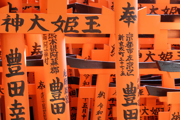 Lots of orange shrine with signs