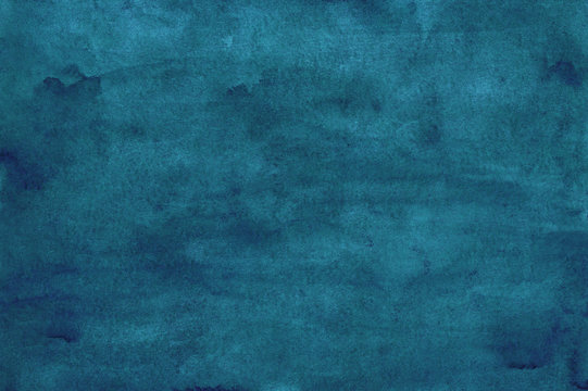 Watercolor peacock blue background texture, stains on paper. Hand painted dark blue watercolour backdrop.