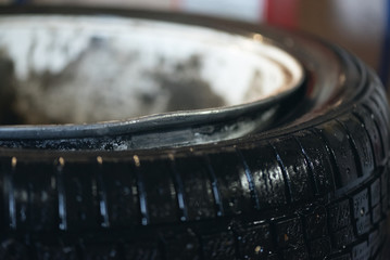 Bent car wheel rim close up background.