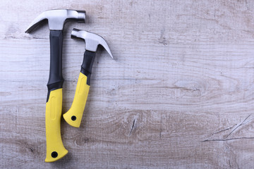 Hammer iron on wooden background