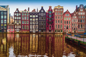 Traditional old dutch medieval houses in Amsterdamon on canal, Netherlands