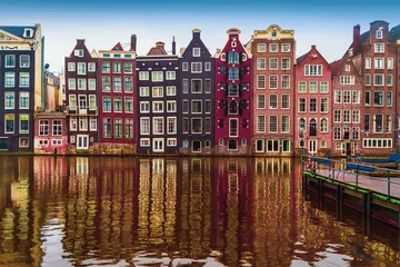 Fototapeten Traditional old dutch medieval houses in Amsterdamon on canal, Netherlands © svetlanais
