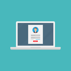 login form, the login page opens in a web browser window on the laptop screen.