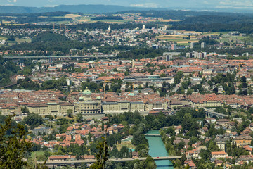 Obraz premium Bern, Switzerland - July 30, 2019: Panoramic view at sunny summer day fro the top of Gurten Mountain Park. Telephoto lens shot
