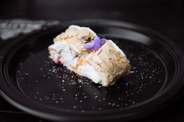 Meringue roulade with cream. 