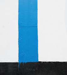 Wall is painted in different colors. Abstract background or texture