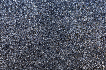 Close-up of natural granite stone. Abstract full frame textured background.