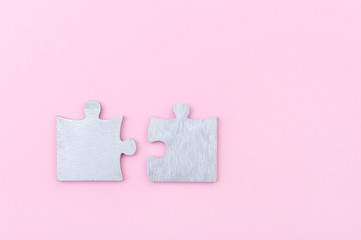 Top view of puzzle pieces isolated on pink. Success abstract concept. Game and play symbols.