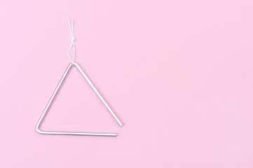 Metal Triangle On Pink Background, Music Instrument