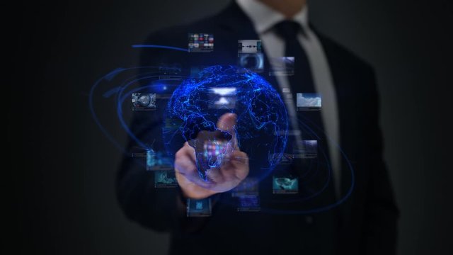 Businessman working on a futuristic holographic interface. Touchscreen. Digital Tablet. 