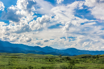 Beauty In Nature Summer Landscape. Amazing Blue Sky With Beautiful Clouds, Mountains, Field With Green Grass. Aerial Rural View In Rio de Janeiro District. Brazilian Countryside.