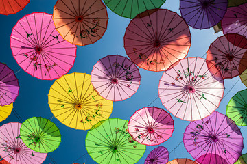 Colorful umbrellas shading one of the streets in downtown Georgetown, Penang, Malaysia.