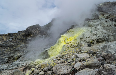 One of the steam vents covered in sulphur deposit at Mt. Sibayak stratovolcano in Sumatra, Indonesia.