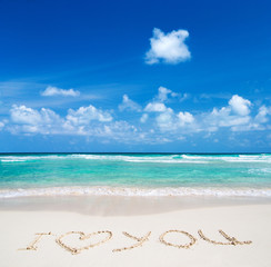 Sea and blue sky. Blue sea water and  sky with white fluffy clouds. Horizontal background of blue sea. Tropical landscape